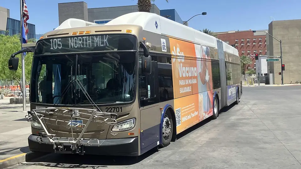 An RTC articulated bus on Route 105, North MLK, at a stop in Las Vegas.