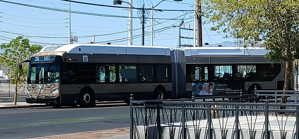 An RTC articulated bus driving down a Las Vegas street.